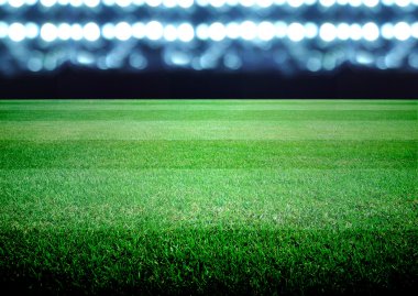 futbol sahası ve parlak ışıklar