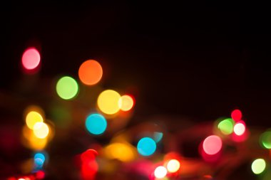 Siyah arkaplanda soyut Bokeh ışıkları