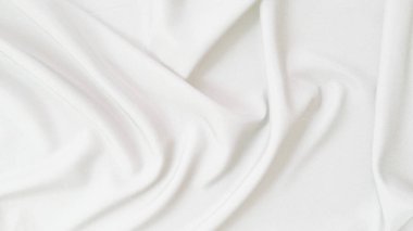 Arkaplan için dalga desenli soyut beyaz kumaş.
