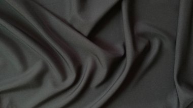 arkaplan için dalga desenli soyut siyah kumaş.