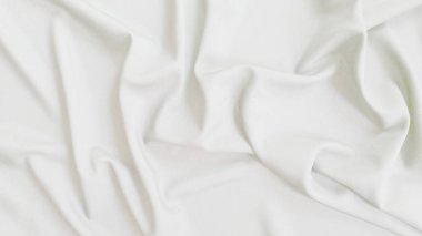 Arkaplan için dalga desenli soyut beyaz kumaş.