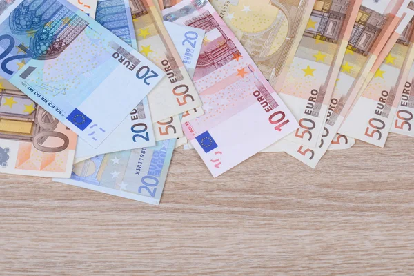 Geld auf Holzuntergrund — Stock Photo, Image