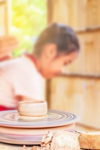 Pottery with a girl on the back. — Stock Photo, Image