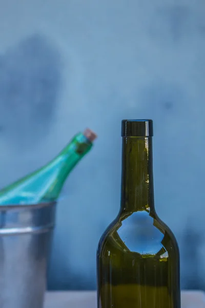 Wine bottle and ice bucket — Stock Photo, Image