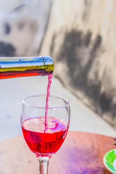 Red wine into a glass — Stock Photo, Image