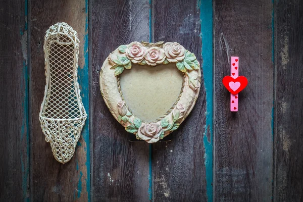 Frame and gift on a wooden — Stock Photo, Image