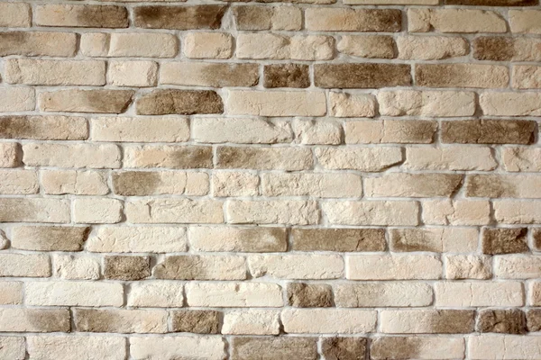 Achtergrond van licht beige bakstenen muur - selectieve aandacht, kopie ruimte — Stockfoto