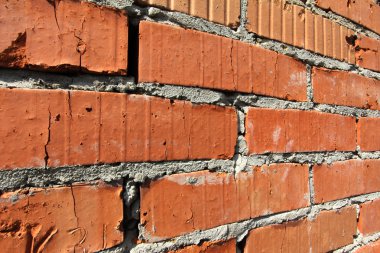 Arka plan eski kırmızı tuğla duvar desen doku. Büyük için grafiti yazıtları.