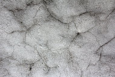 Kirli çizilmiş doku, arka plan için bir duvar, aşınmış eski gri sıva