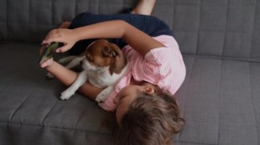 4k. little cute caucasian girl play in phone