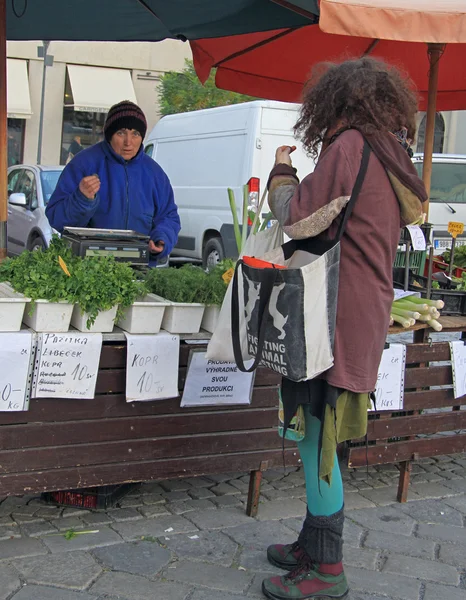 Woman is selling greenery on the street market — Stock Photo, Image