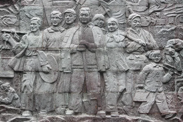 Retrato do relevo de trabalhadores chineses na pedra — Fotografia de Stock