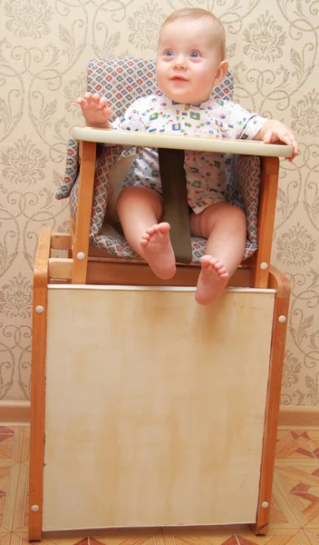 Adorable baby on highchair, at home — Stock Photo, Image