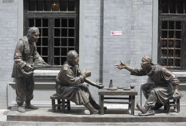 Sculpture composition representing life of chinese people in old times on Qianmen street — Stock Photo, Image