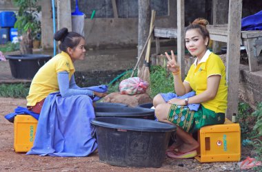 laotian girls are resting in duration of working shift clipart