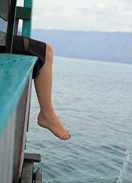 legs of beautiful girl, lake Toba, Indonesia