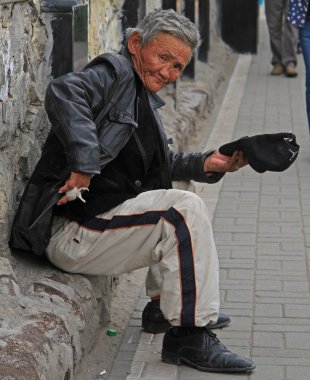 beggar is trying to get some money on the street in Ulaanbaatar
