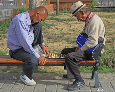 two men are playing chess in park of Ulaanbatar, Mongolia