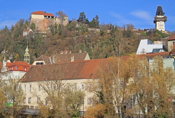 Clock tower and some other buildings in Graz — Stock Photo, Image