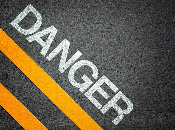 Nebezpečí Text zápisu silničního asfaltu — Stock fotografie
