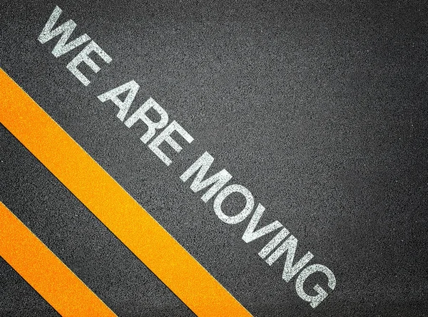 We are moving - Text Writing Road Asphalt — Stockfoto