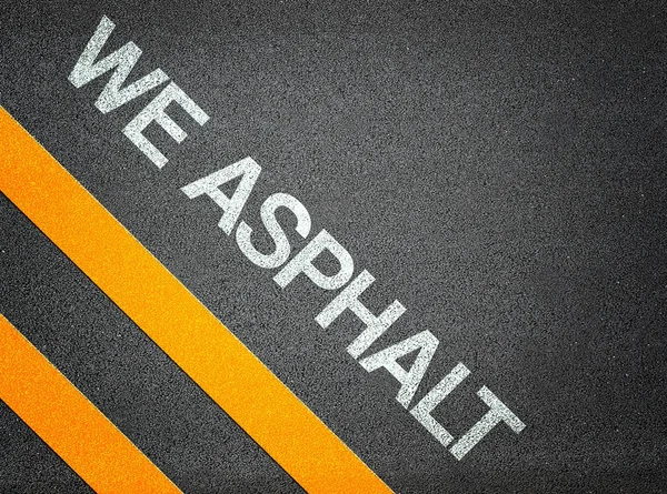 We asphalt - tekst schrijven weg asfalt — Stockfoto