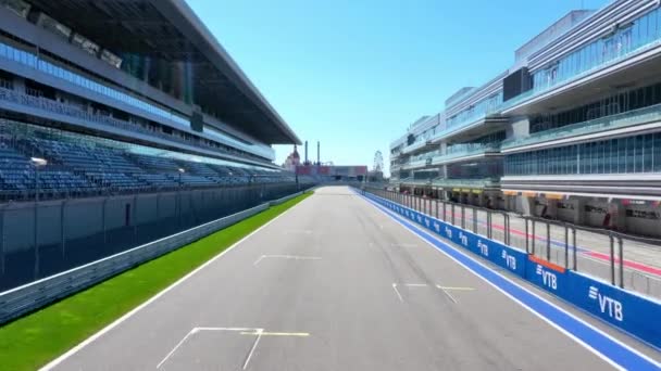 Sochi, Russia - 01 apr 2021: stand and track Sochi Autodrom, start and finish area, air view — стокове відео