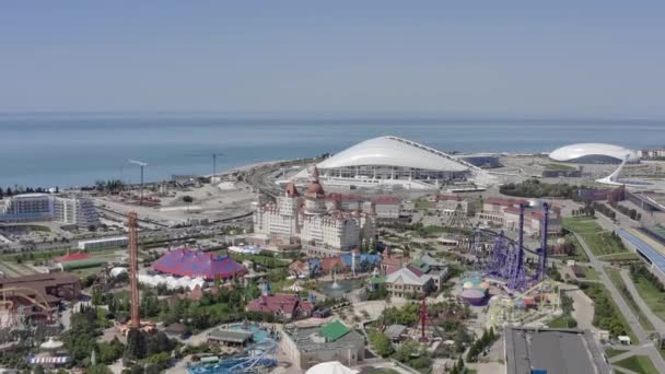 Sochi Park - theme park in the city of Sochi. Aeria view. An amusement park. Top view. Summer. Vacation at the resort. Sochi Olympic Park. The Black Sea. — Stock Video