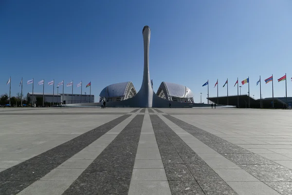 The Olympic flame in the background of the Fisht stadium. Olympic Park. Sochi — Stock Photo, Image