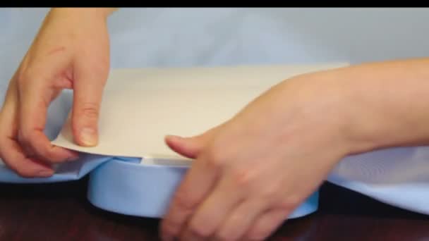 Woman folding shirt in industrial sewing factory — Stock Footage Woman folding shirt in industrial sewing factory Stock Footage