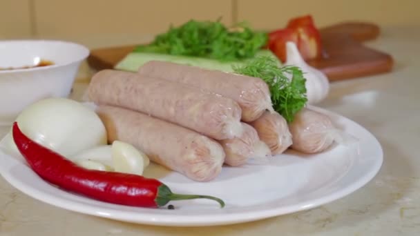 Bratwurst sausages, onion, chili pepper,vegetables — Stock Video