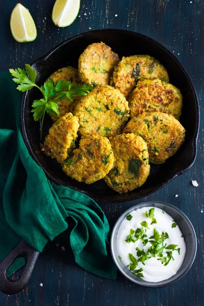 Vegetarian chickpeas and spinach  fritters on cast iron pan with — Stock Photo, Image