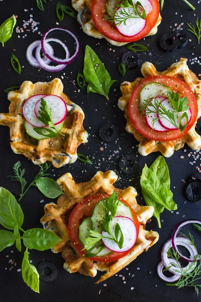 Savory waffles with cheese, ham, olives and herbs, served with f — Stock Photo, Image