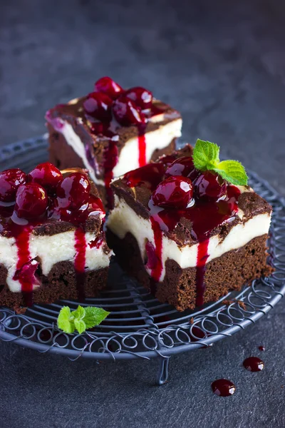 Cheesecake brownies  with cherry sauce, selective focus — Stock Photo, Image