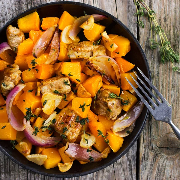 Roasted pumpkin and meat on the pan — Stock Photo, Image