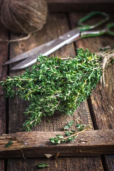 Thyme bunch on an old wooden background — Stock Photo, Image