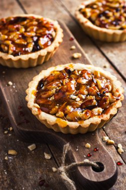 Tart with nuts and caramel  clipart