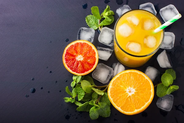 Fresh orange juice on dark background - Stock Image - Everypixel