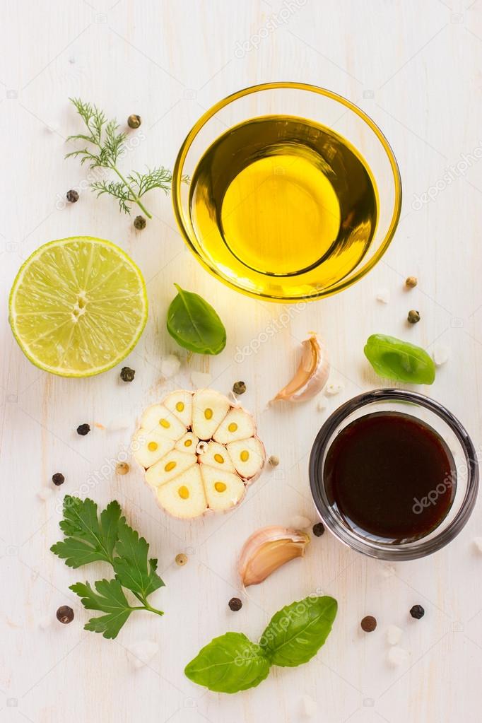 Ingrediets for salad dressing. Olive oil, garlic, balsamic vineg Stock