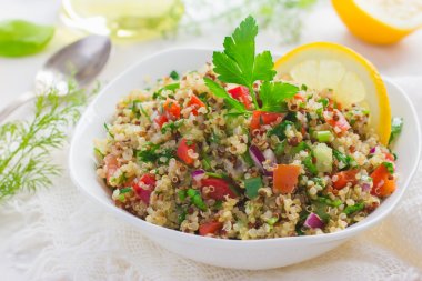 Tabbouleh salad with quinoa, parsley and vegetables clipart