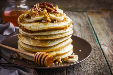 Pancakes with banana and honey clipart