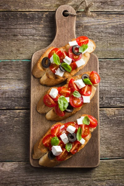 Bruschetta with tomato and feta cheese — Stock Photo, Image