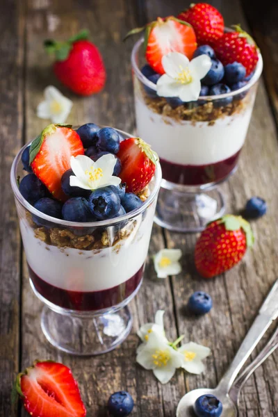 dessert with  berries,  cream cheese, granola  and berries  jam