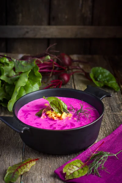Beetroot cream soup on rustic background — Stock Photo, Image