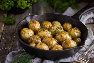 Oven Baked potatoes with herbs  clipart