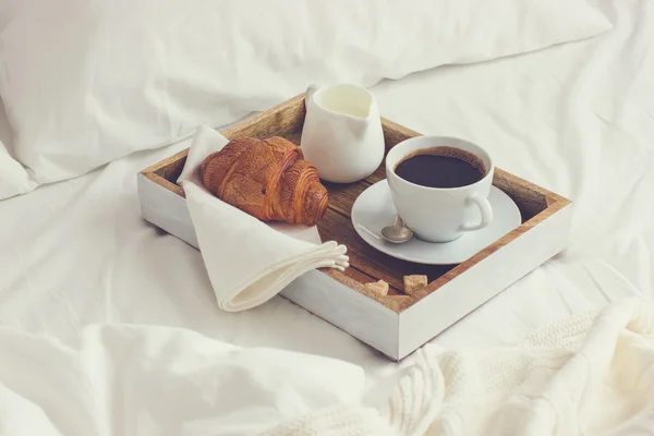 Breakfast in bad, tray with cup of coffee and croissant — Stock Image Breakfast in bad, tray with cup of coffee and croissant Stock Photo