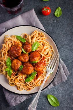 Spaghetti pasta  with meatballs and tomato sauce clipart