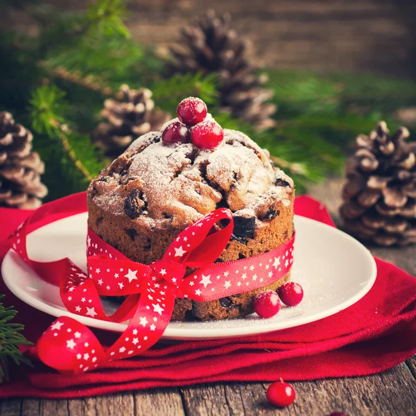 Kleine vruchtencake voor kerstdiner Stockafbeelding