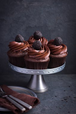 Chocolate cupcakes with chocolate frosting  clipart