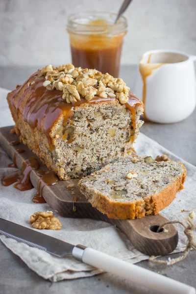 Banana bread cake with walnuts and salted caramel — Stock Photo, Image